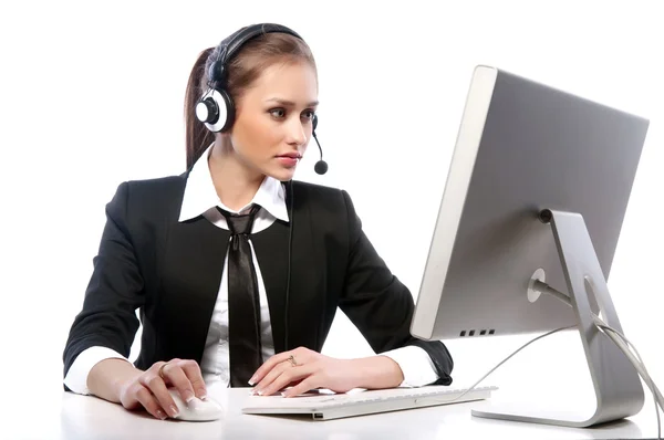 A young woman working at the computer on a white background — Stock Photo, Image