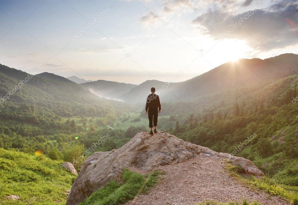 Traveler staring at the mountains.