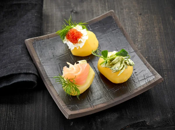 Decorated boiled potatoes on plate — Stock Photo, Image