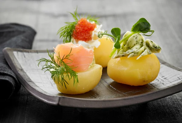 Decorated boiled potatoes on plate — Stock Photo, Image