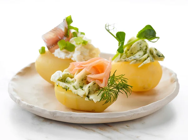 Decorated boiled potatoes on plate — Stock Photo, Image