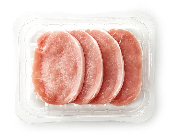 Raw pork chops in plastic try — Stock Photo, Image