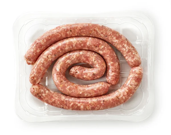 Raw pork sausages in plastic try — Stock Photo, Image