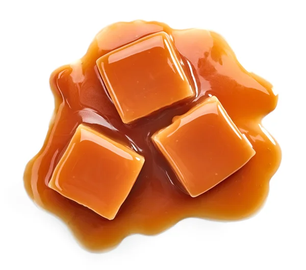 Karamellbonbons und süße Sauce — Stockfoto