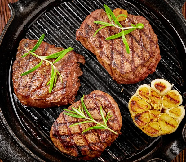 Beef steak on cooking pan — Stock Photo, Image