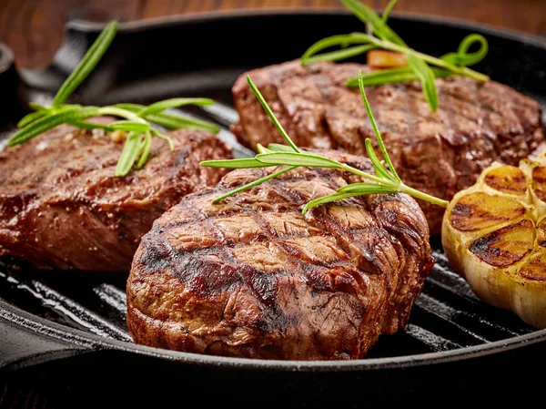 Beef steak on cooking pan — Stock Photo, Image