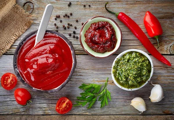 Various sauces on wooden table — Stock Photo, Image