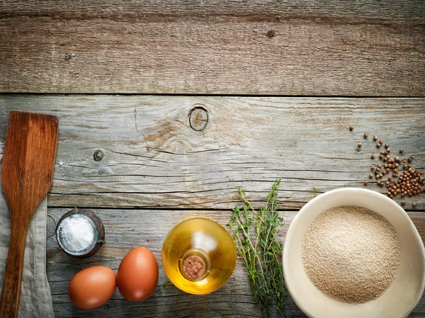 Cooking ingredients on wooden table — Stock Photo, Image