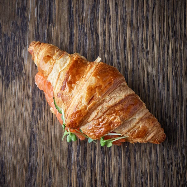 Fresh Croissant Salmon Greens Wooden Table Top View — Zdjęcie stockowe