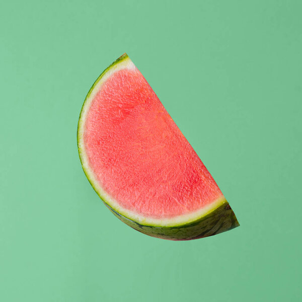 fresh raw watermelon piece isolated on green background