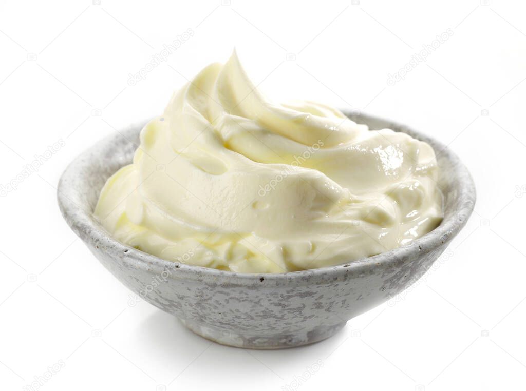 bowl of whipped mascarpone cream cheese isolated on white background