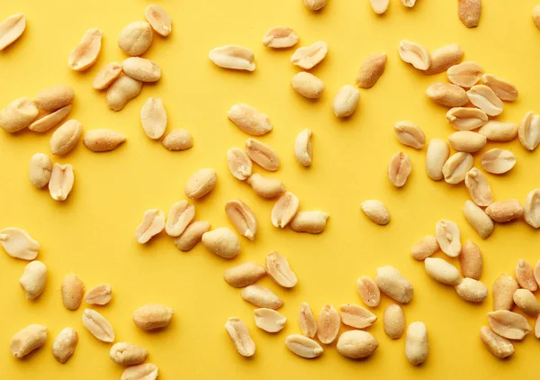 Roasted Salted Peanuts Yellow Background Top View — Stock Photo, Image