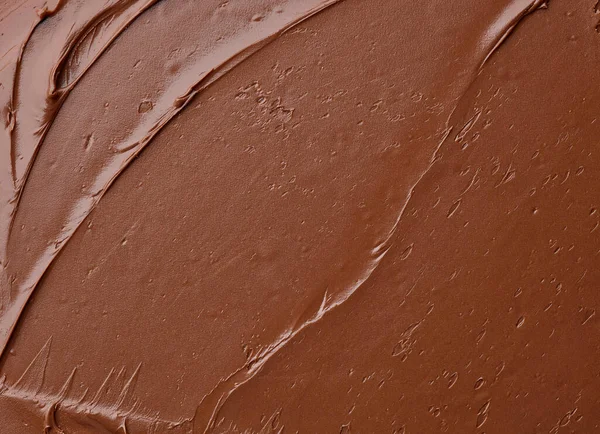 溶かしたチョコレートクリームの背景トップビュー — ストック写真