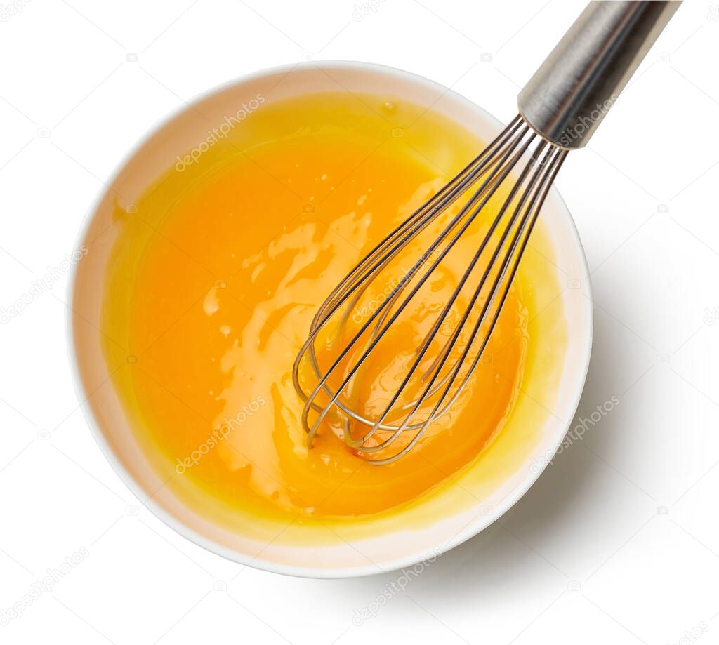 bowl of mixing egg yolks isolated on white background, top view