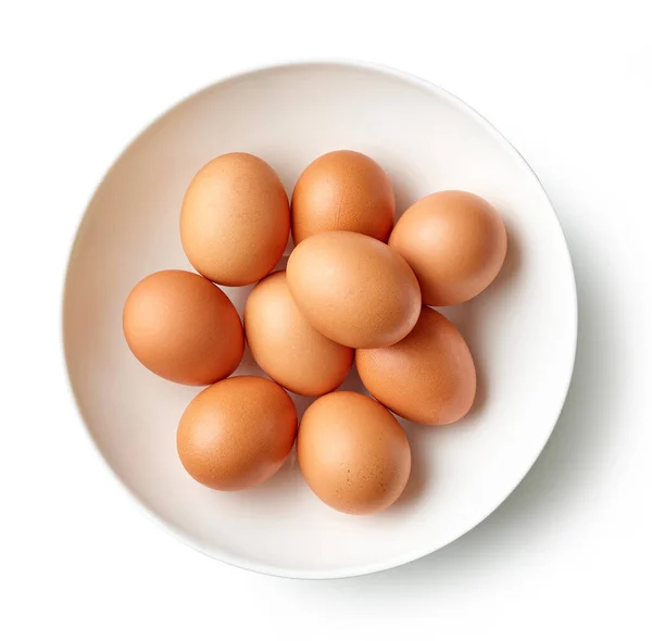 白地に隔離された新鮮な茶色の鶏の卵のボウルトップビュー — ストック写真