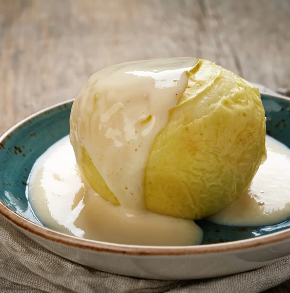 Baked apple with vanilla sauce — Stock Photo, Image