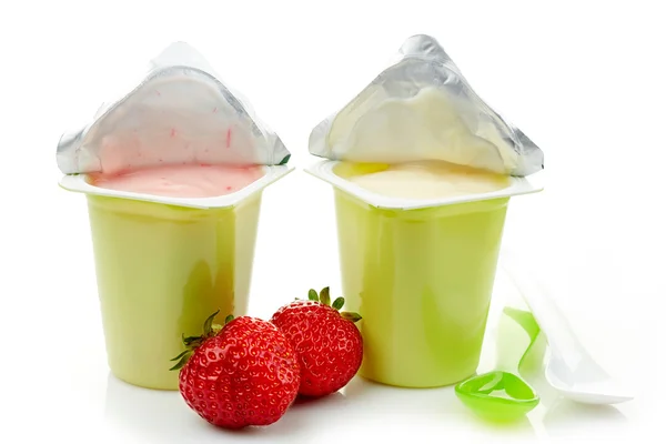 Two plastic yogurt pots — Stock Photo, Image