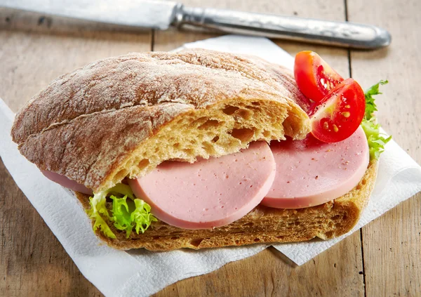 Sandwich with sausage and tomato — Stock Photo, Image