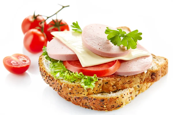 Breakfast sandwich with sliced sausage and tomato — Stock Photo, Image