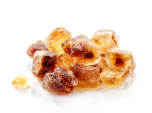 Brown caramelized sugar cubes on a white background — Stock Photo, Image