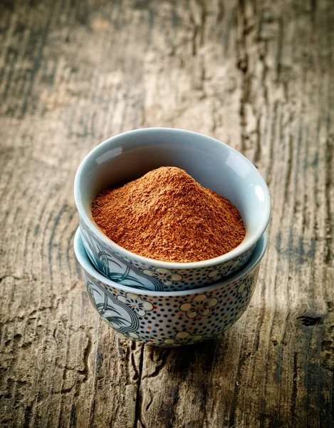 Bowl of cinnamon powder — Stock Photo, Image