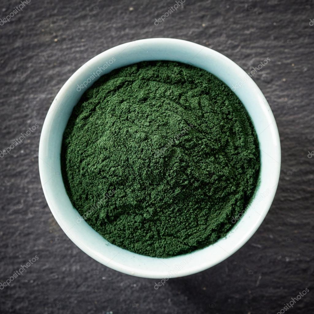 Bowl of spirulina algae powder Stock Photo by ©magone 66187359