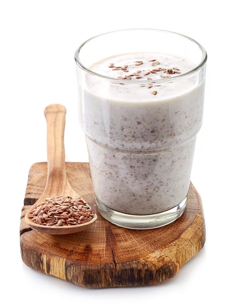 Glass of greek yogurt with crushed flax seeds — Stock Photo, Image