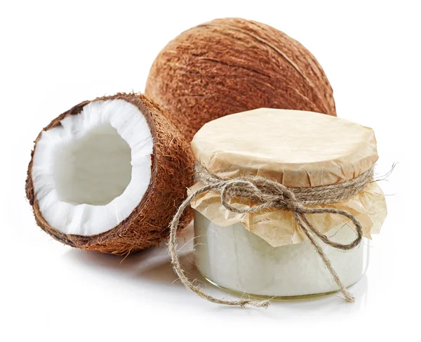 Coconut oil and fresh coconuts — Stock Photo, Image