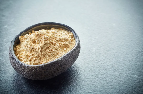 Bowl of maca powder — Stock Photo, Image