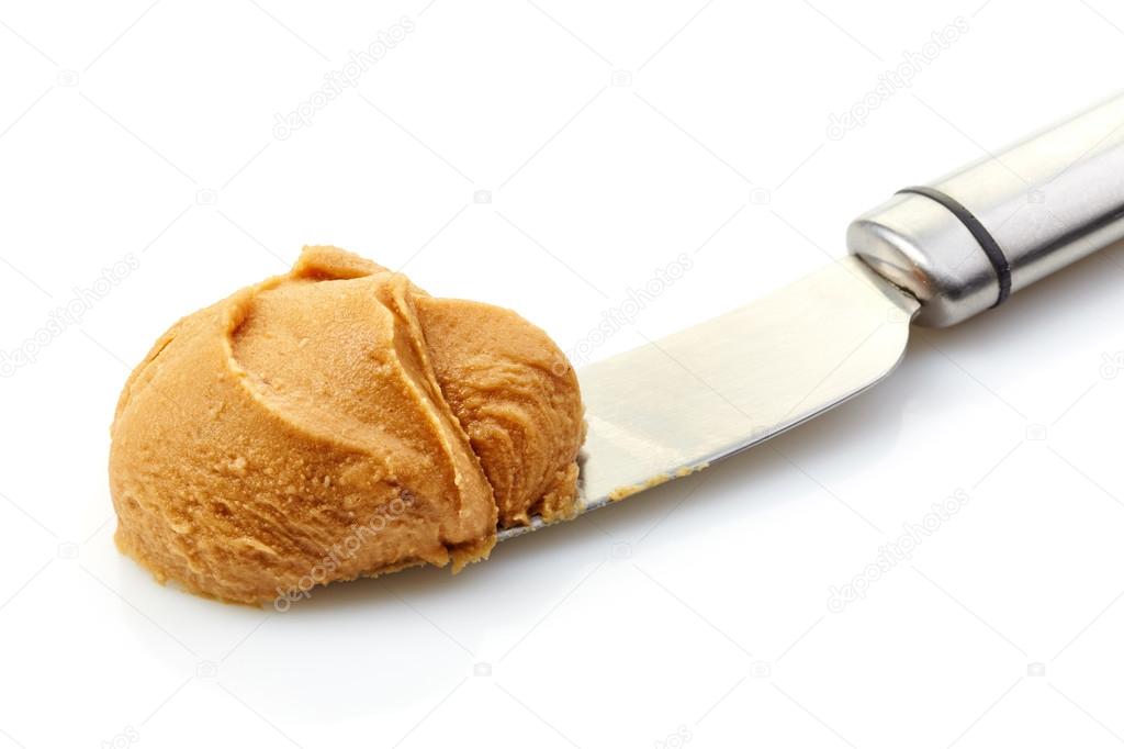 peanut butter spread on a knife