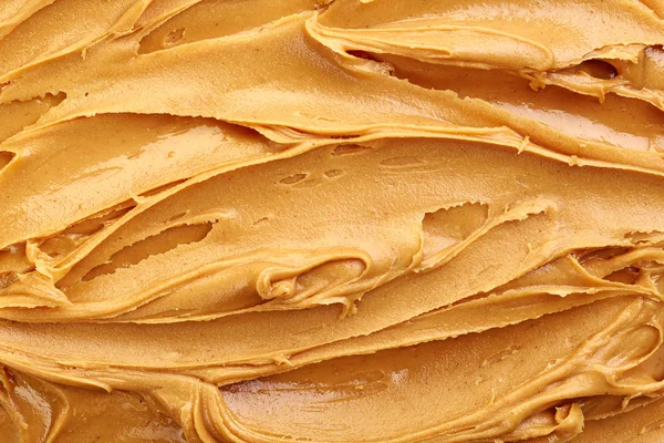 Erdnussbutter Hintergrund — Stockfoto