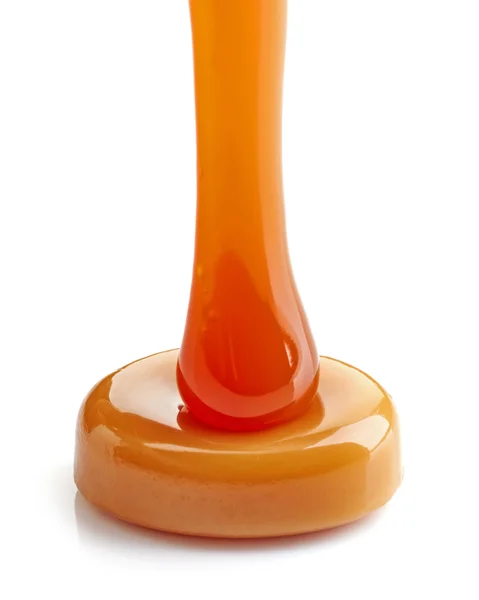 Caramel candy and sweet sauce — Stock Photo, Image