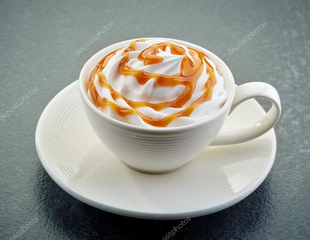 Caramel latte coffee with whipped cream Stock Photo by ©magone 73729623