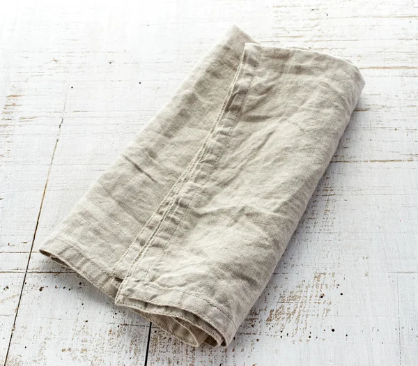 Linen napkin on wooden table — Stock Photo, Image