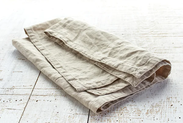 Linen napkin on wooden table — Stock Photo, Image