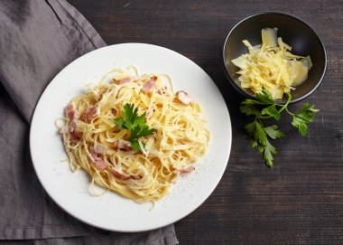 pasta carbonara on white plate clipart