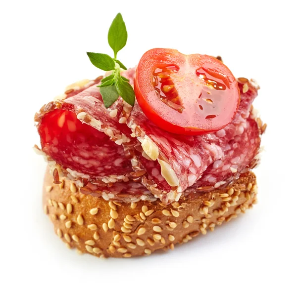 Toasted bread with salami and tomato — Stock Photo, Image