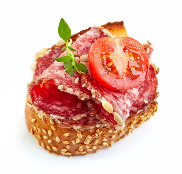 Toasted bread with salami and tomato — Stock Photo, Image