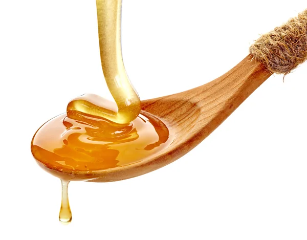 Colher de madeira com mel — Fotografia de Stock