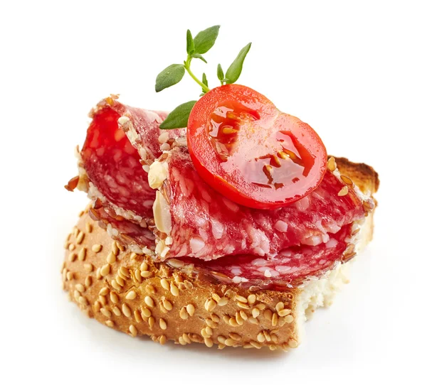 Toasted bread with salami and tomato — Stock Photo, Image