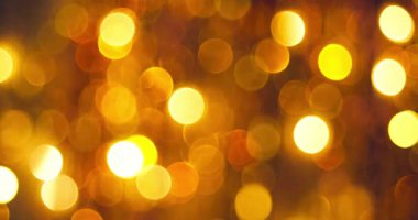 Altın gibi parlak noel ışıkları ışıl ışıl arka plan