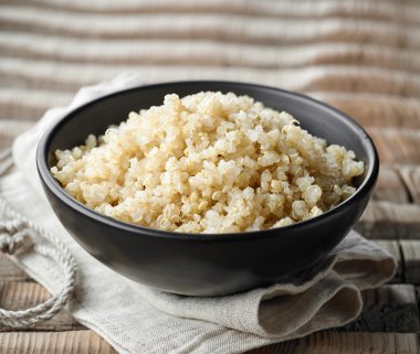 Bowl of boiled quinoa clipart