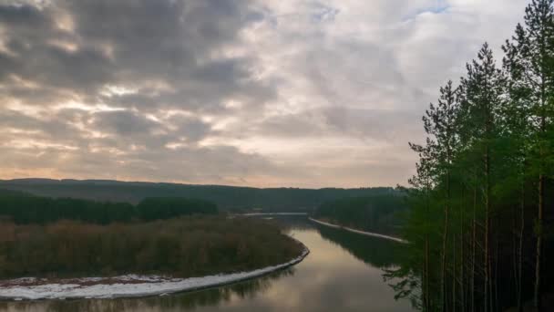 Partly cloudy weather over the winter river, time-lapse — Stock Video