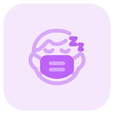 Küçük çocuk maske takarken uyuyor.