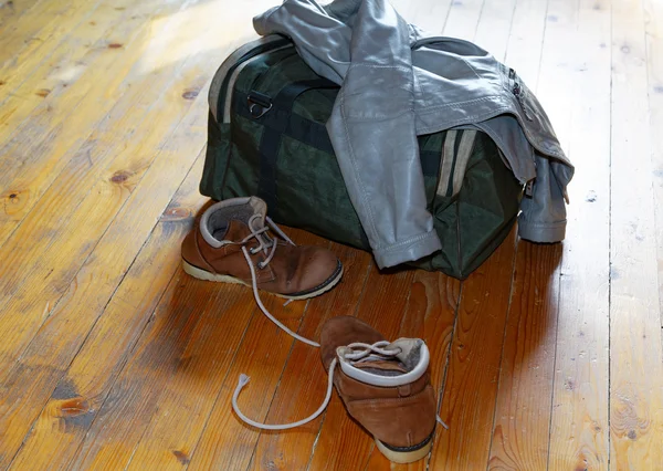 Lady's jacket and shoes on the floor of the room — Stock Photo, Image