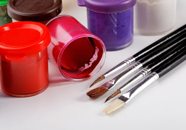 Jars of gouache and brush for drawing — Stock Photo, Image