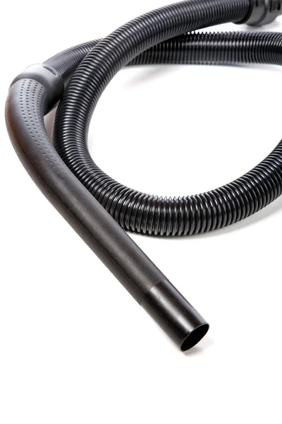 Black hose of the vacuum cleaner isolated on a white background — Stock Photo, Image