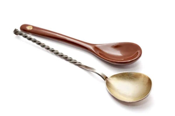 Steel and ceramic spoon on a white background — Stock Photo, Image