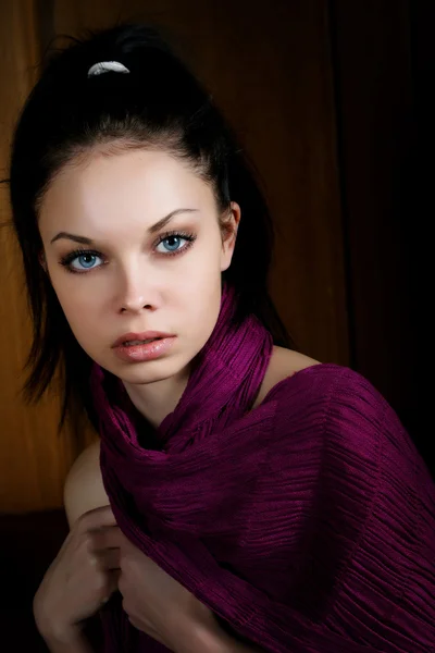 The girl with a violet scarf in an interior — Stock Photo, Image