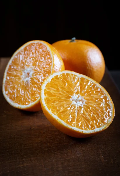 Tangerine cut on an old table closeup — Stock Photo, Image